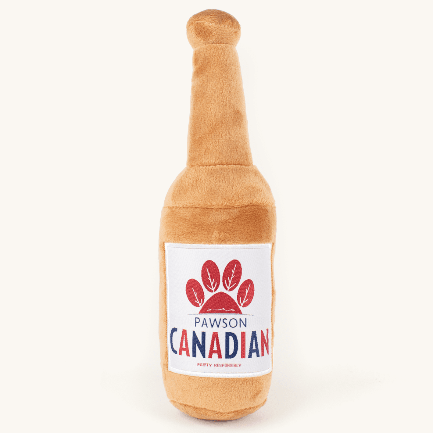 Plush Pawson Canadian dog toy on a plain cream studio background