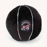 Plush basketball-shaped Toronto Barkers dog toy on a plain cream background